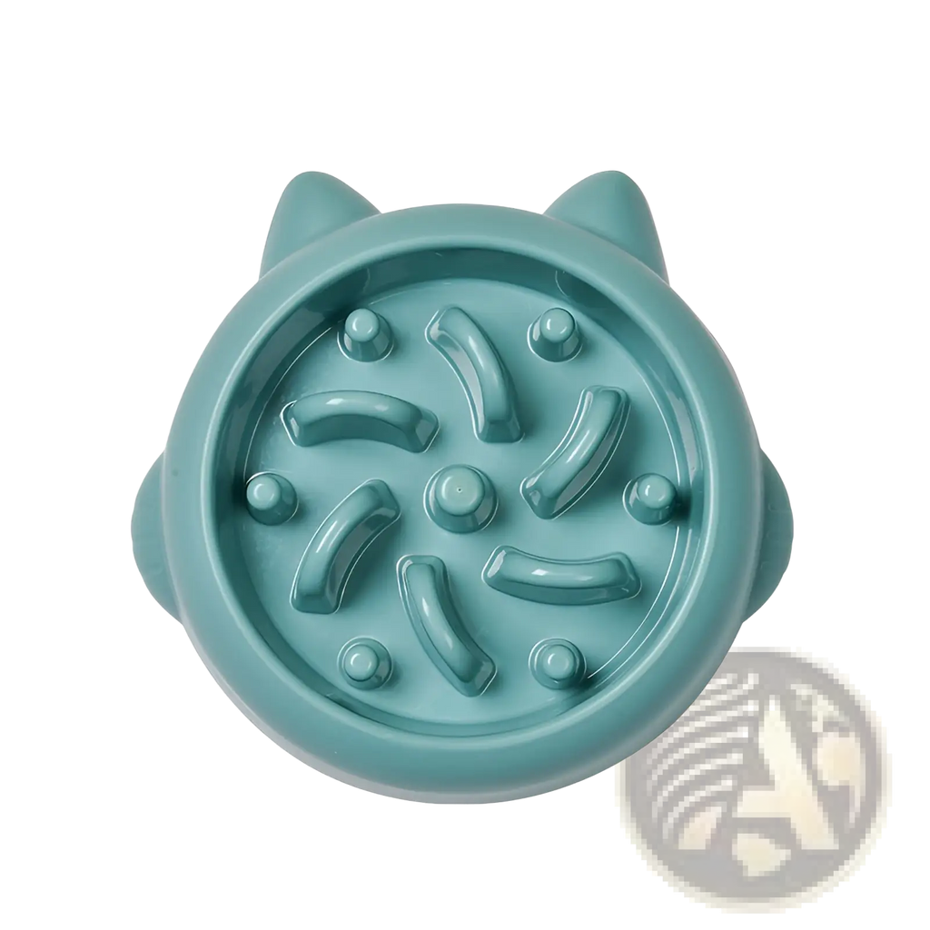Teal slow feeder dog bowl made of silicone with raised ridges and bumps designed to prevent gulping during feeding