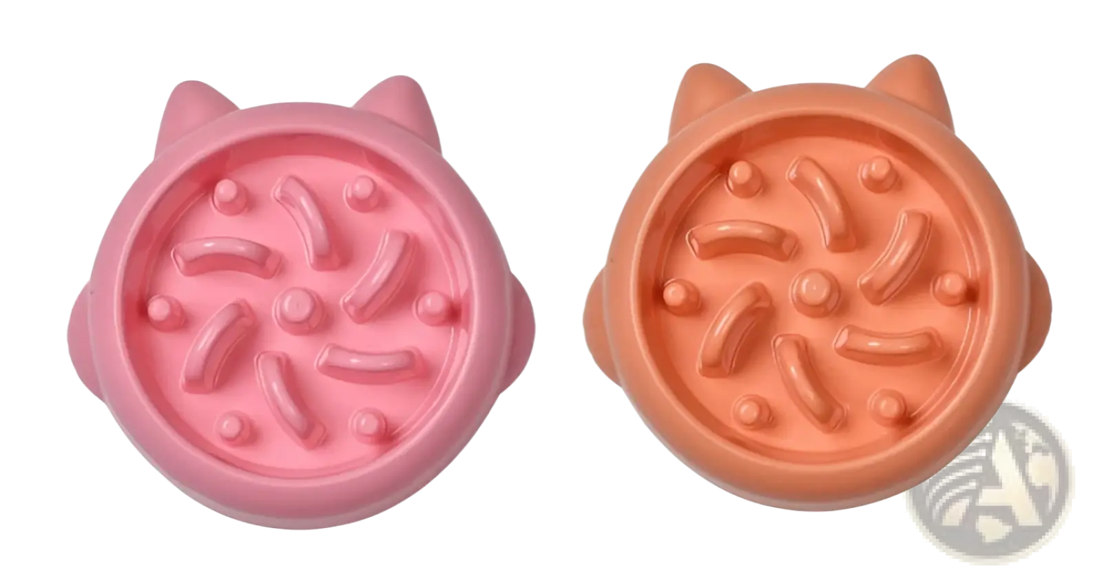 Slow feeder dog bowl made of pink and orange silicone with cat shape and raised ridges for anti gulping control