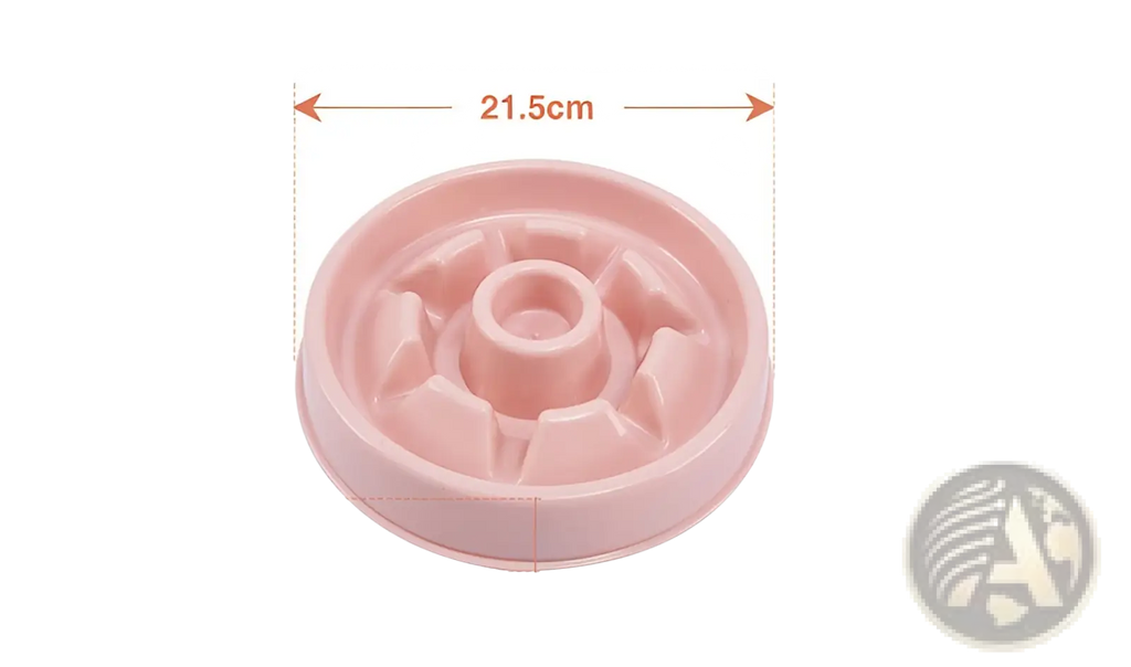 Pink plastic slow feeder dog bowl with central hole and radial ridges designed as an anti choke pet dish