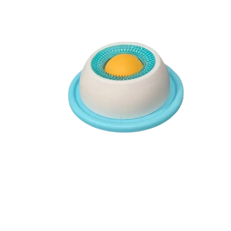A compact slow feeder pet lick mat bowl with white base light blue rim and textured teal ring around central yellow ball