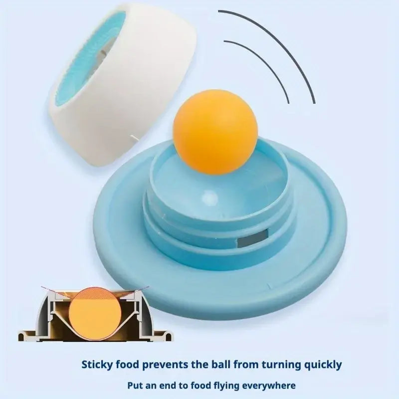 Light blue plastic slow feeder cat toy with a yellow ball on top for interactive treat feeding
