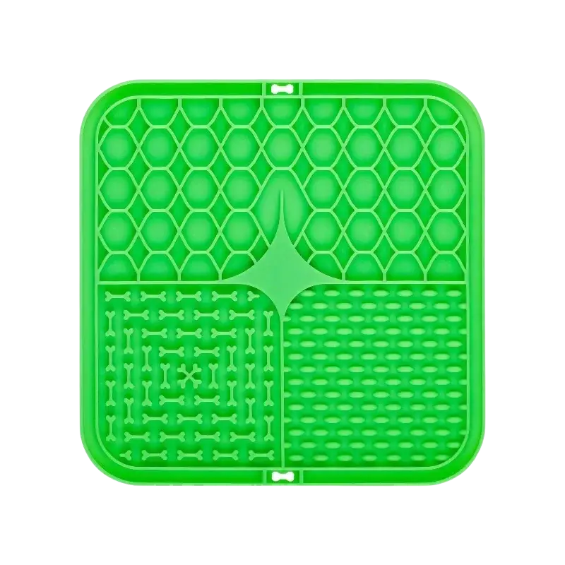 Bright green silicone slow feeder pet lick silicone mat with honeycomb pattern bone-shaped indentations for controlled mealtime