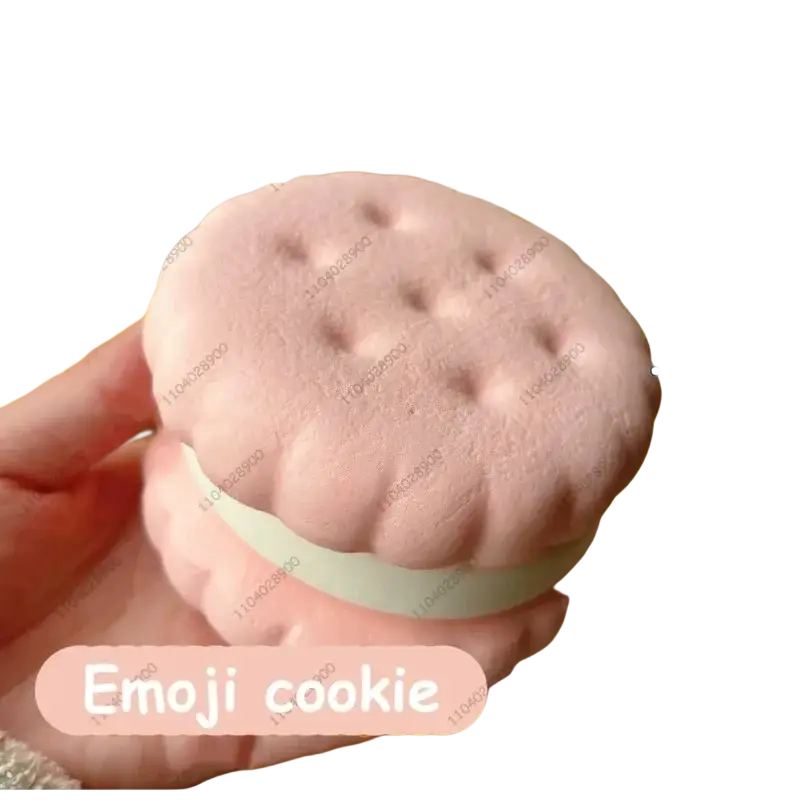 Slow rising big cookie squishy toy in soft pink with strawberry theme and light green filling, featuring a realistic cake texture