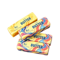 Three colorful swirled salted butter stick stress relief toys with vibrant rainbow patterns and blue lettering on yellow packaging