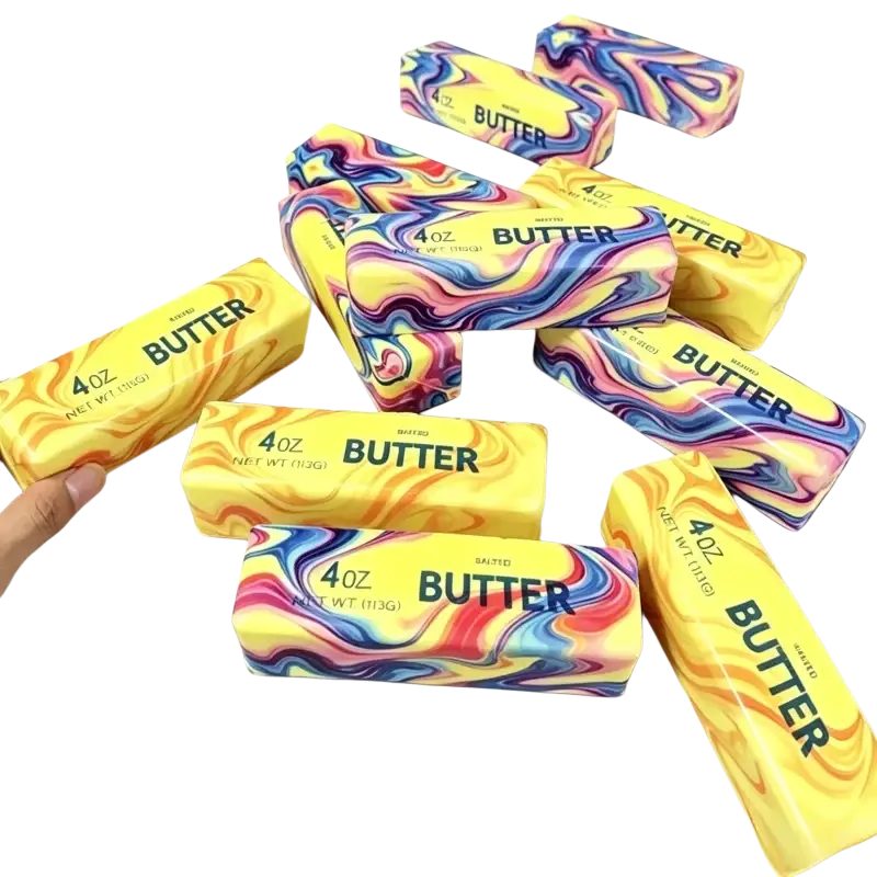 Vibrant marbled 4 oz slow rising butter stick stress relief toy with swirling rainbow patterns on yellow packaging