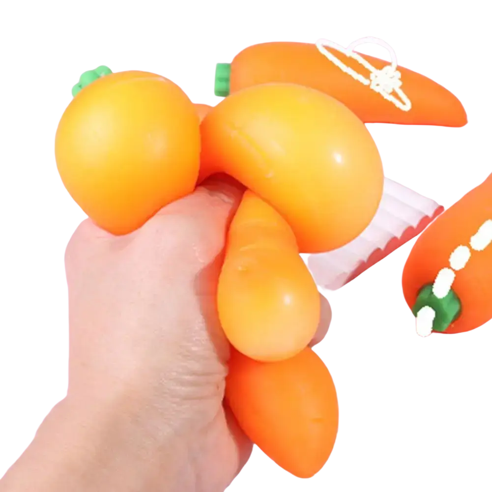 Slow rising carrot squishy stress toy in orange with green leafy top and smooth glossy surface for stress relief