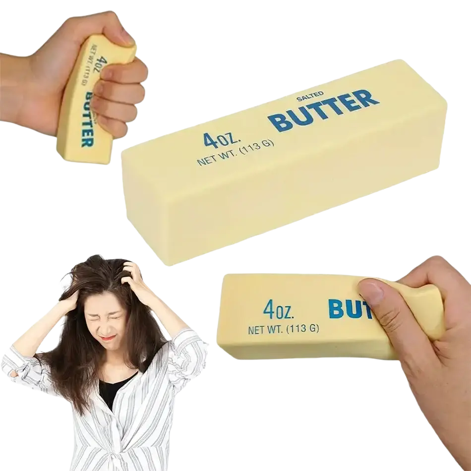 A pale yellow rectangular slow rising squishy butter block with blue text for stress relief and butter squeeze use