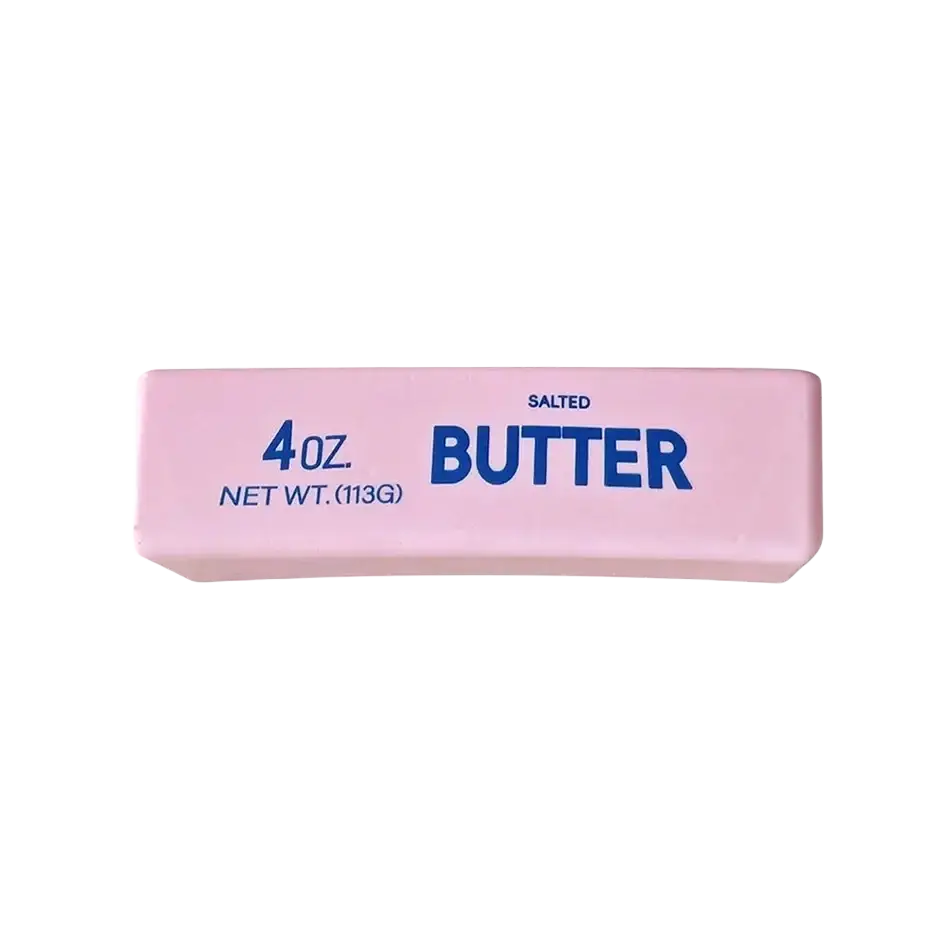 Pink rectangular slow rising squishy butter stress relief toy labeled 4 oz and net wt for butter squeeze use