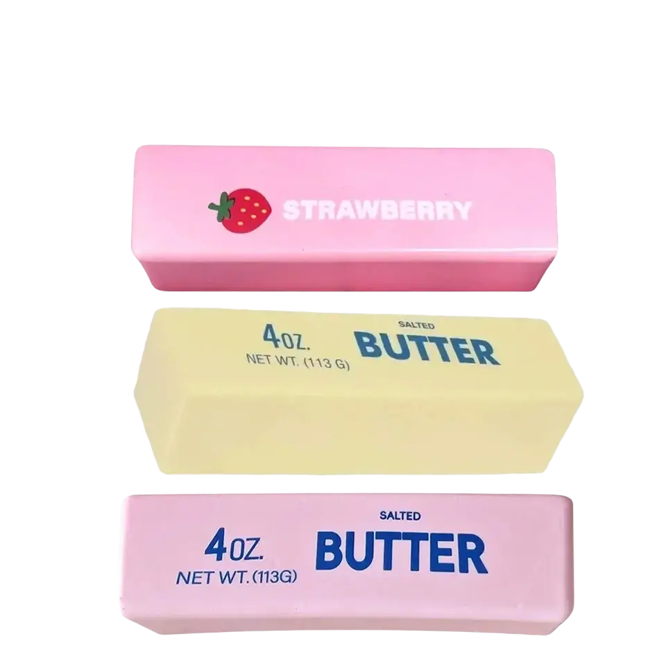 Slow rising squishy butter stress relief toy with pink and yellow butter sticks labeled strawberry for butter squeeze