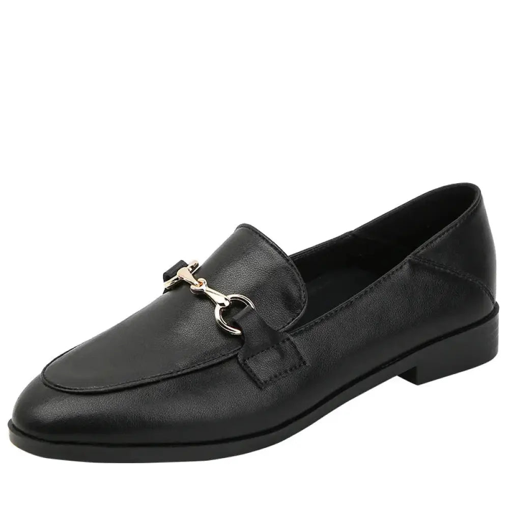 Black leather women’s loafers with a silver horsebit buckle showcasing elegant craftsmanship and style