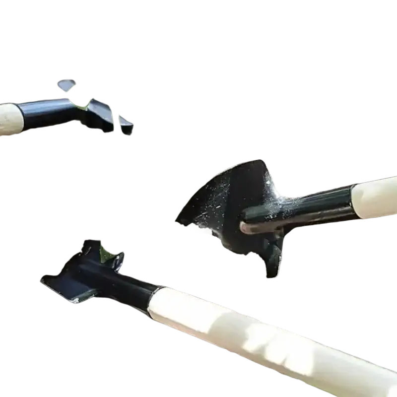 Black metal garden shovel with a light wooden handle small gardening tool resting in soil beside young plant