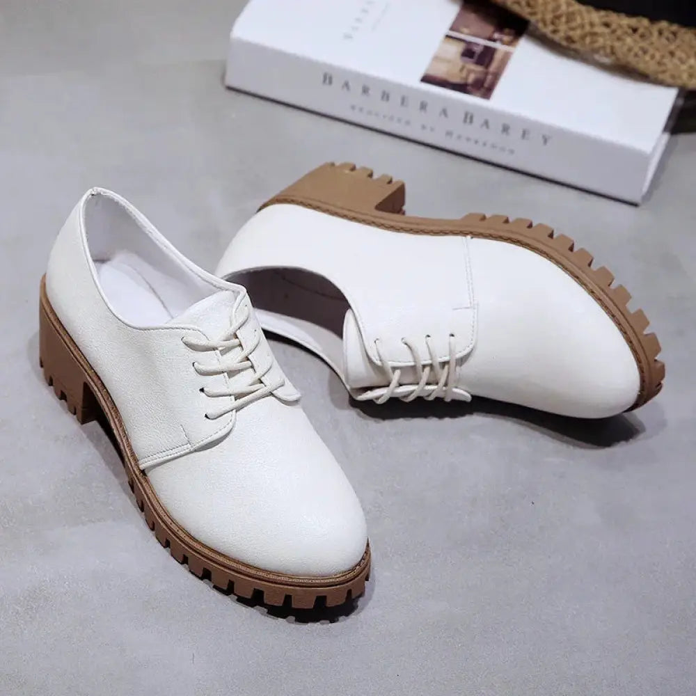 Women’s lace up leather oxford shoes in white with tan rubber chunky soles and heels for stylish comfort