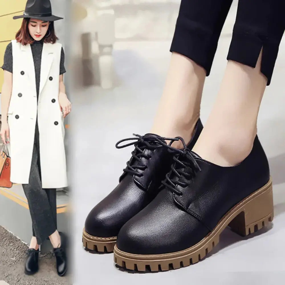 Women’s black leather lace-up oxford shoes with a chunky tan rubber sole for stylish and durable wear