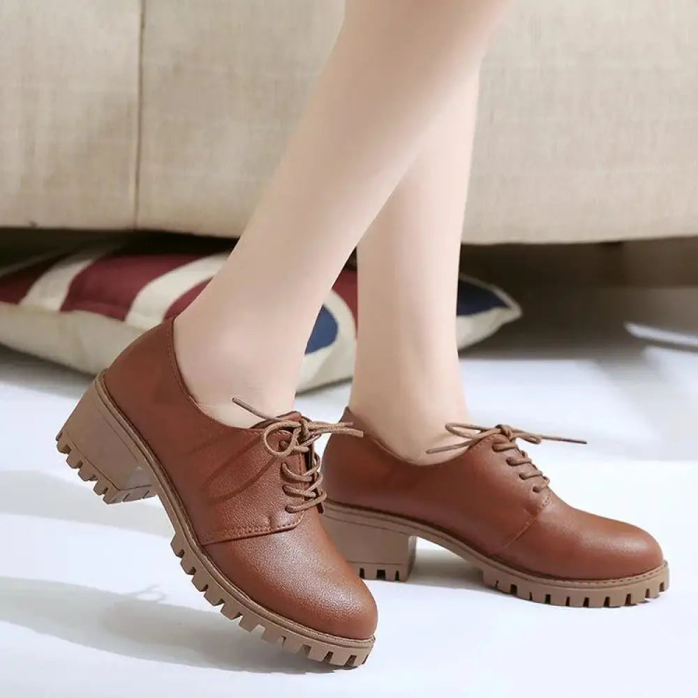 Brown leather lace-up oxford shoes for women with chunky textured heel and durable sole