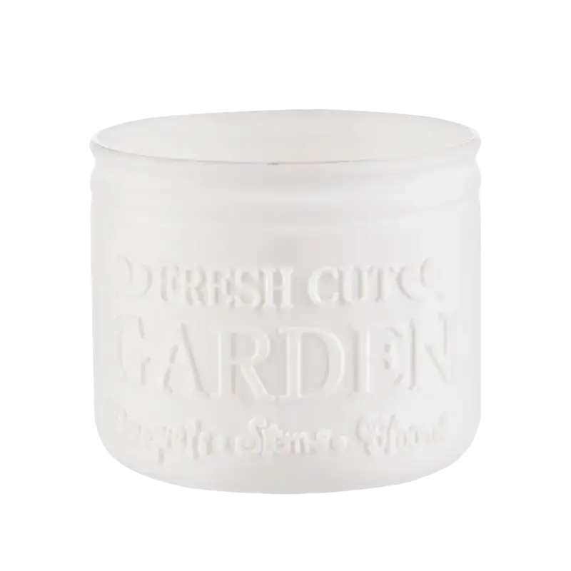A small size frosted white glass candle jar with embossed fresh cuts garden text measuring 8 cm by 9.5 cm