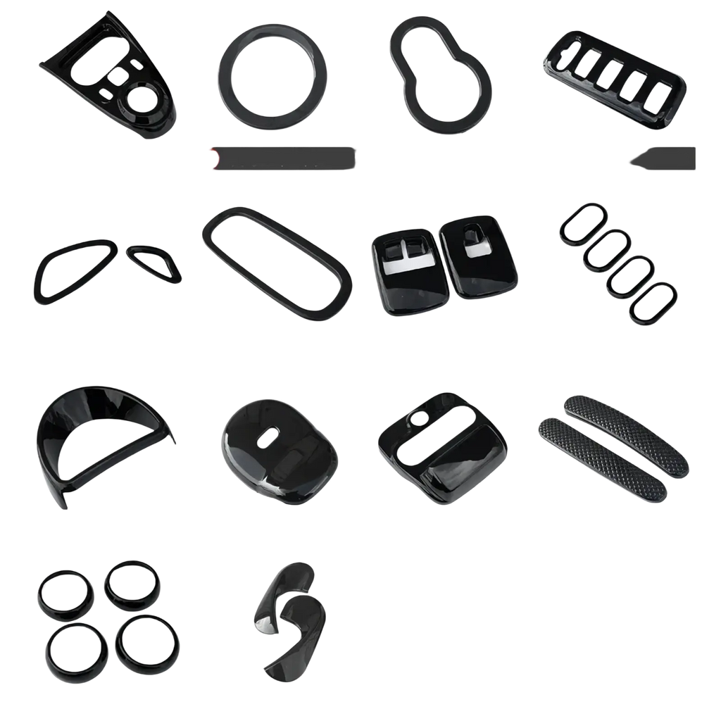Smart 453 black interior exterior trim kit featuring glossy black plastic car trim pieces in various shapes and sizes