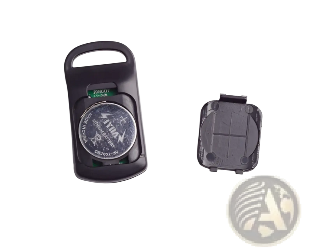 Black plastic smart bluetooth tracker tag with visible circular silver battery for keys pets and kids