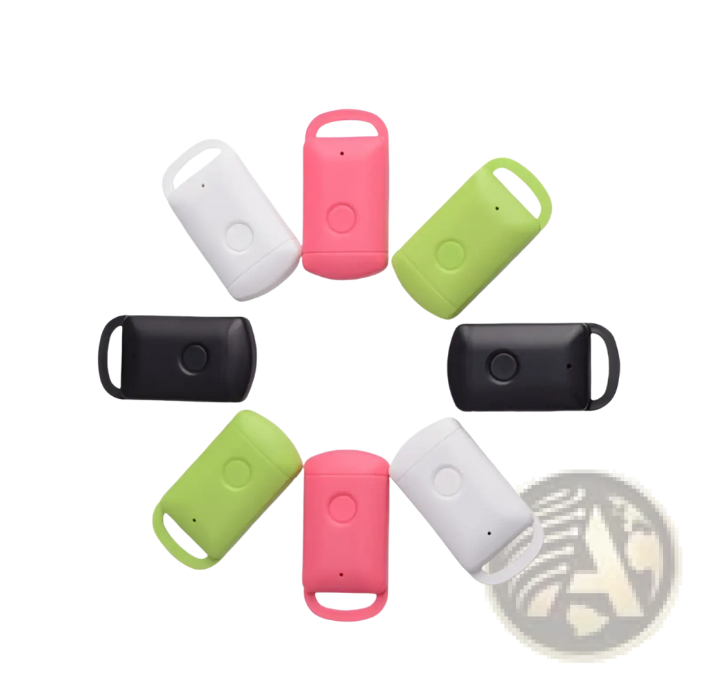 Smart bluetooth tracker tag keychains made of colorful silicone in white pink and green with circular button design