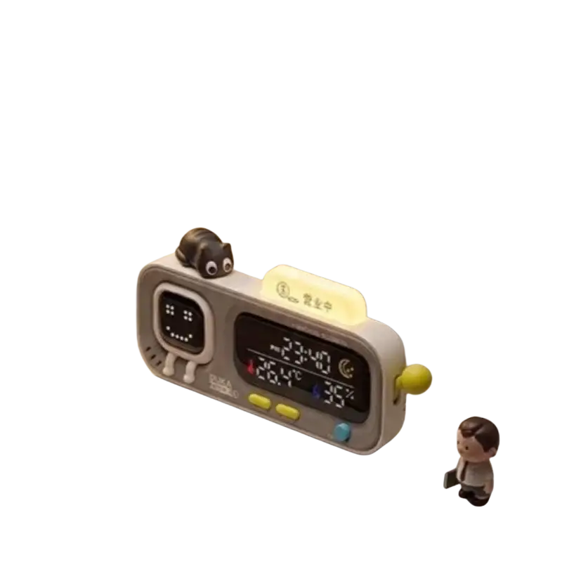 Gray and yellow duka mooda smart temperature alarm clock with cute cartoon face and humidity display