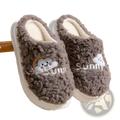 Gray fuzzy plush cotton slippers with embroidered smiling cloud and rainbow design and white sole interior