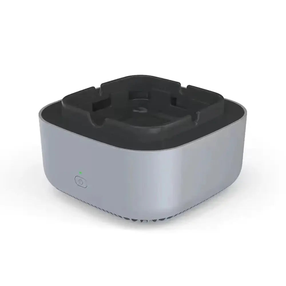 Anion smart smoke purifying portable ashtray with silver metallic body and black plastic top featuring four recessed slots