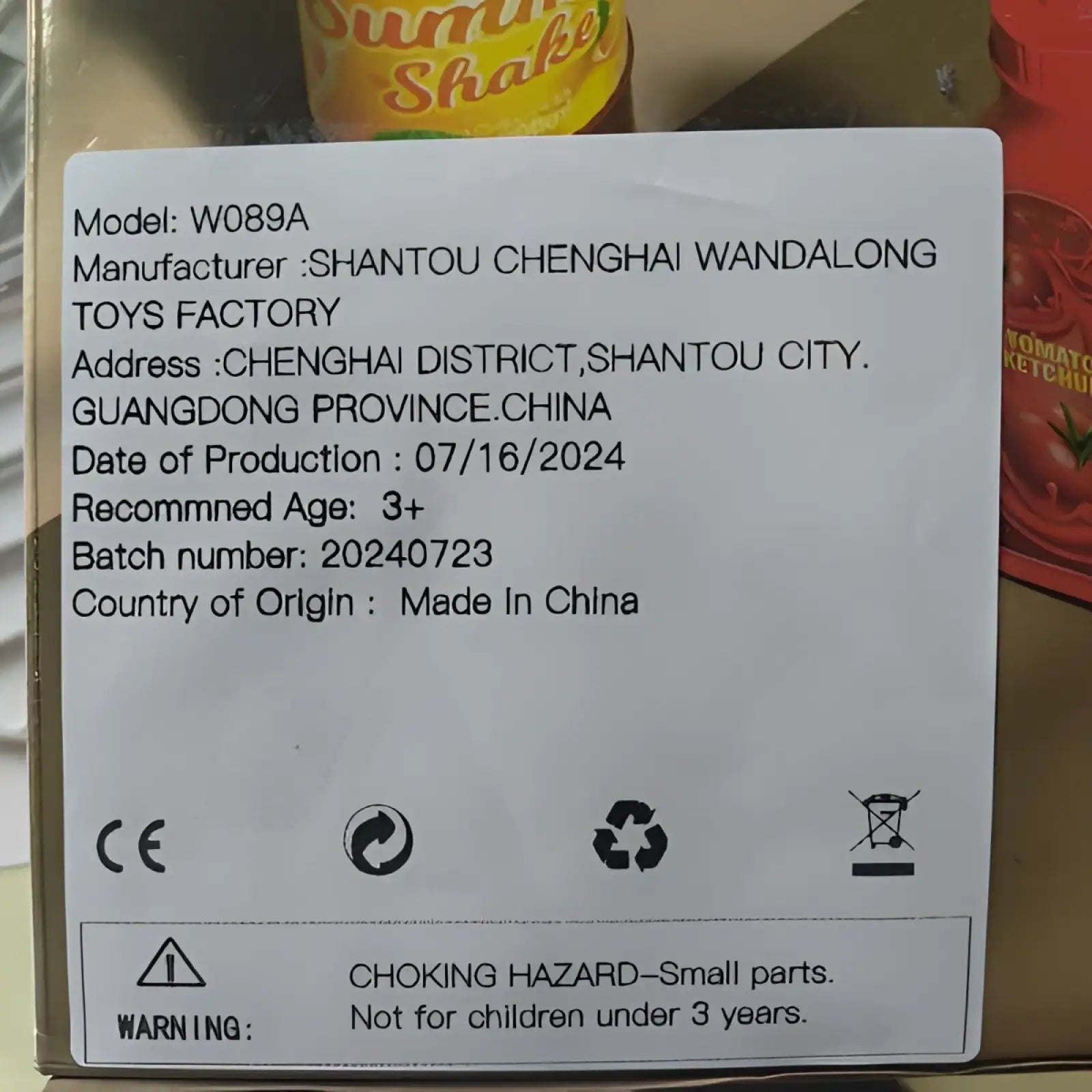 Back of the smoking barbecue grill toy with light and sound showing model w089a and manufacturer details from China