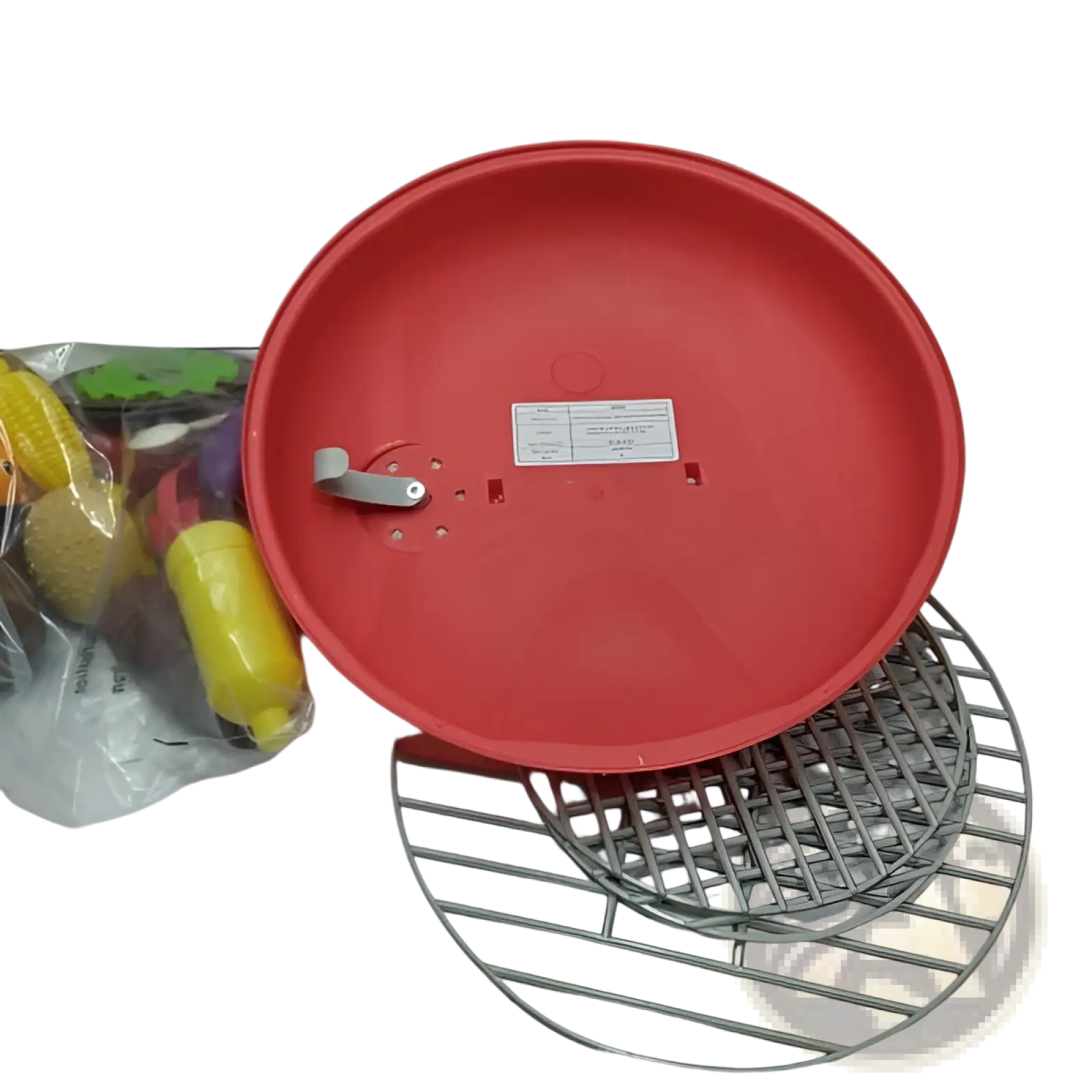 Red plastic circular smoking barbecue grill toy with light and sound showing its back side with silver handle and white label