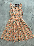 Vintage 1950s style sleeveless peach cotton dress with colorful pineapple heart and leaf pattern and pockets