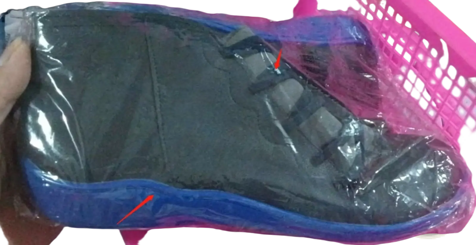 Snake print wedge ankle boots for women in black and blue with a glossy finish wrapped in clear plastic