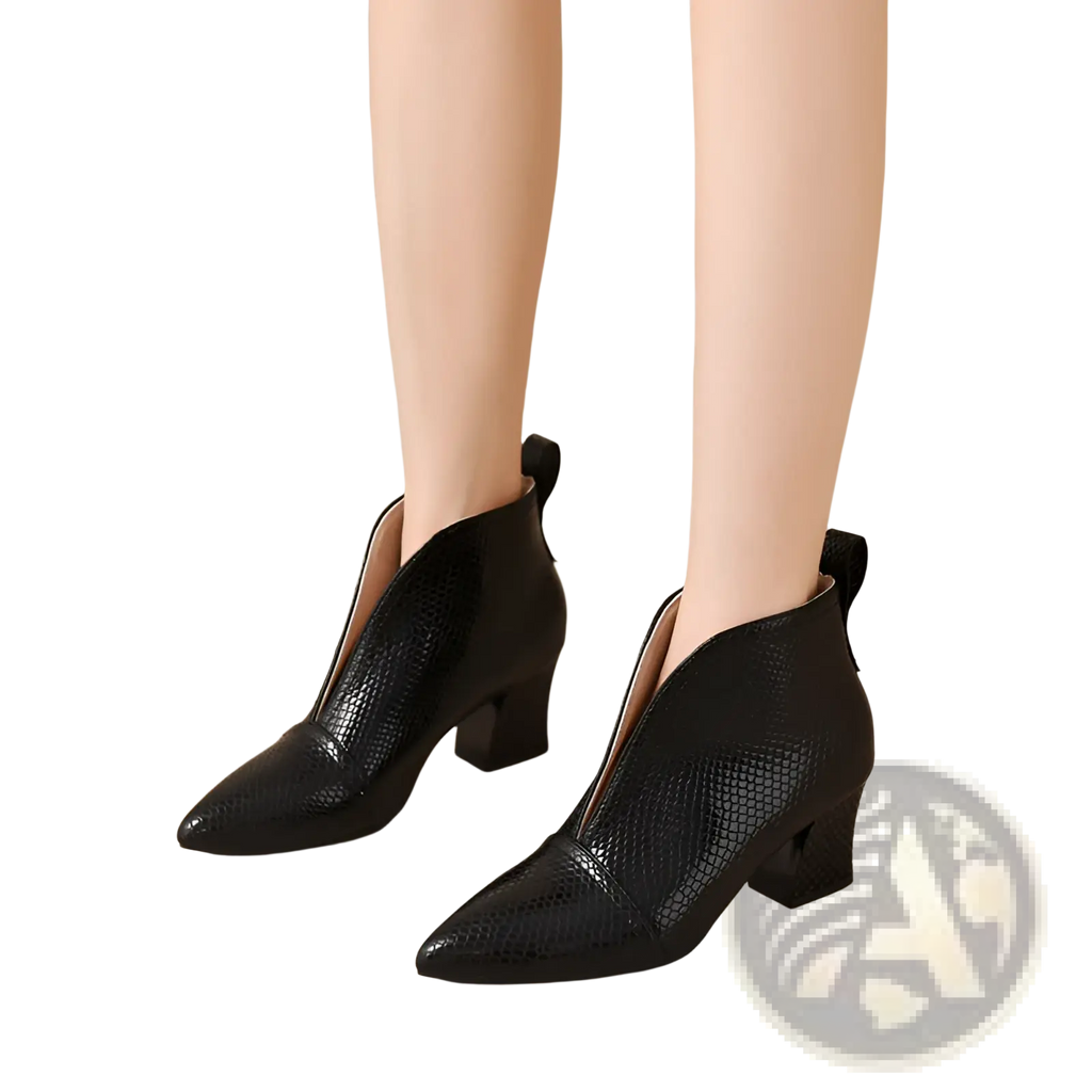 Black snakeskin ankle boots with v cut pointed toe, block heel, and zipper closure