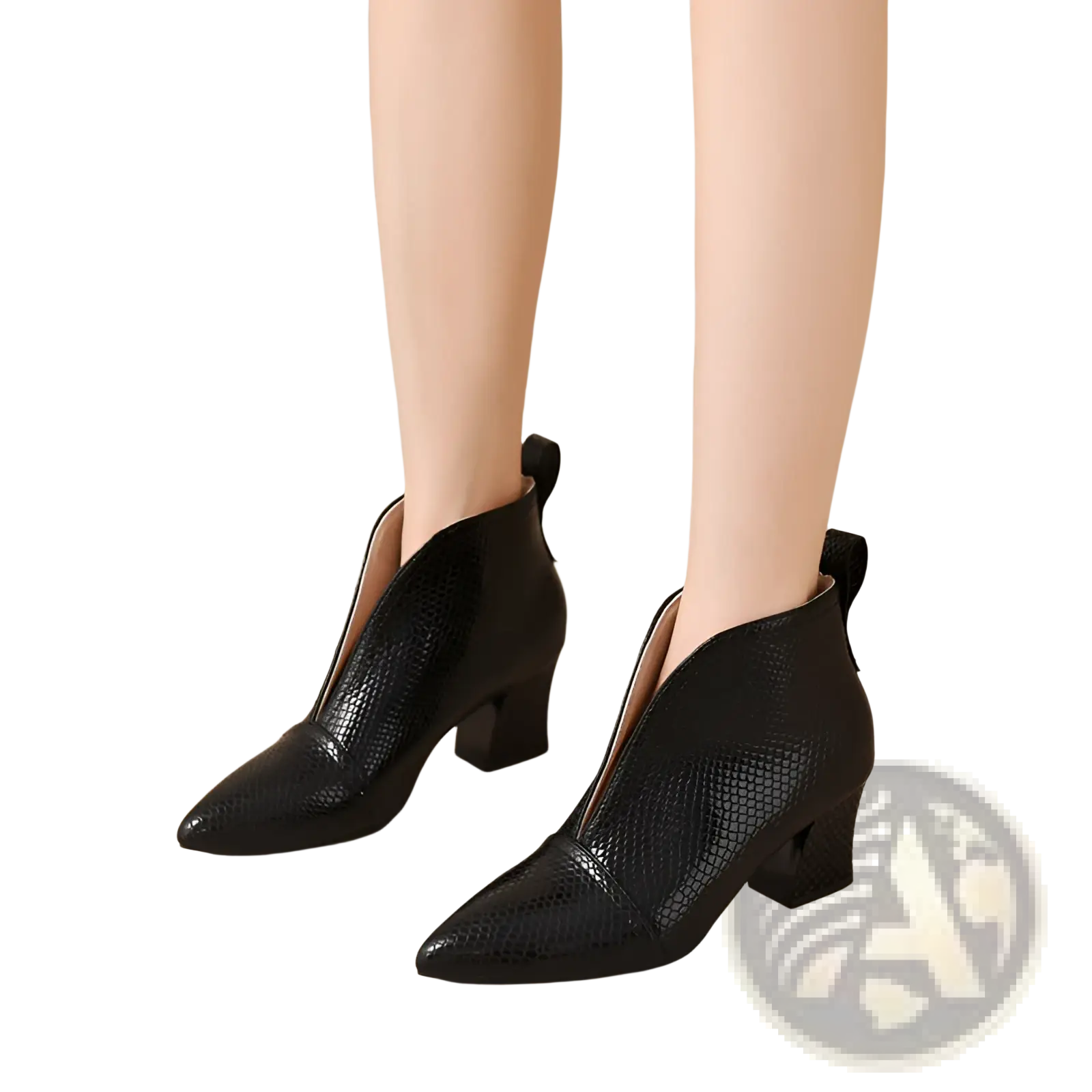 Black snakeskin ankle boots with v cut pointed toe, block heel, and zipper closure