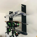 Black handcrafted minimalist wall-mounted snowboard rack holding three snowboards with bindings in use