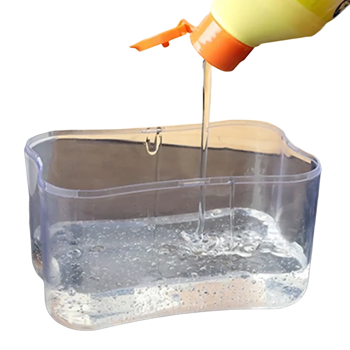 Clear plastic dish soap dispenser with yellow and orange pump top and integrated sponge caddy for kitchen use