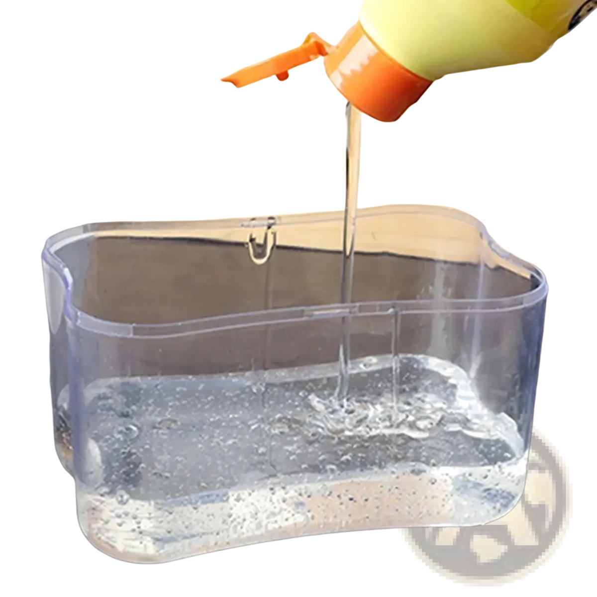Clear plastic dish soap dispenser with yellow and orange pump top and integrated sponge caddy for kitchen use