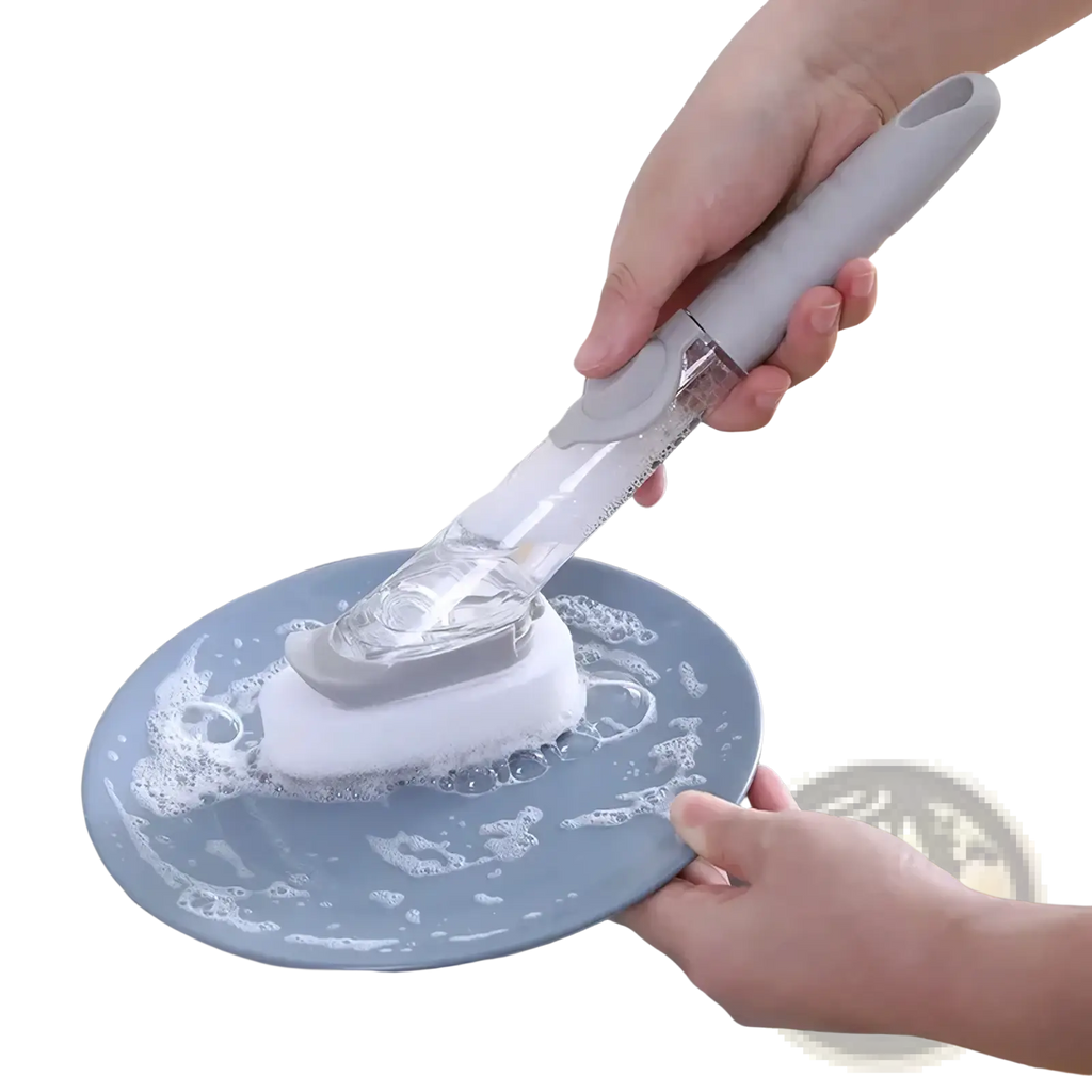 Gray and white plastic soap dispensing dish brush with sponge head and long handle scrubbing a blue plate