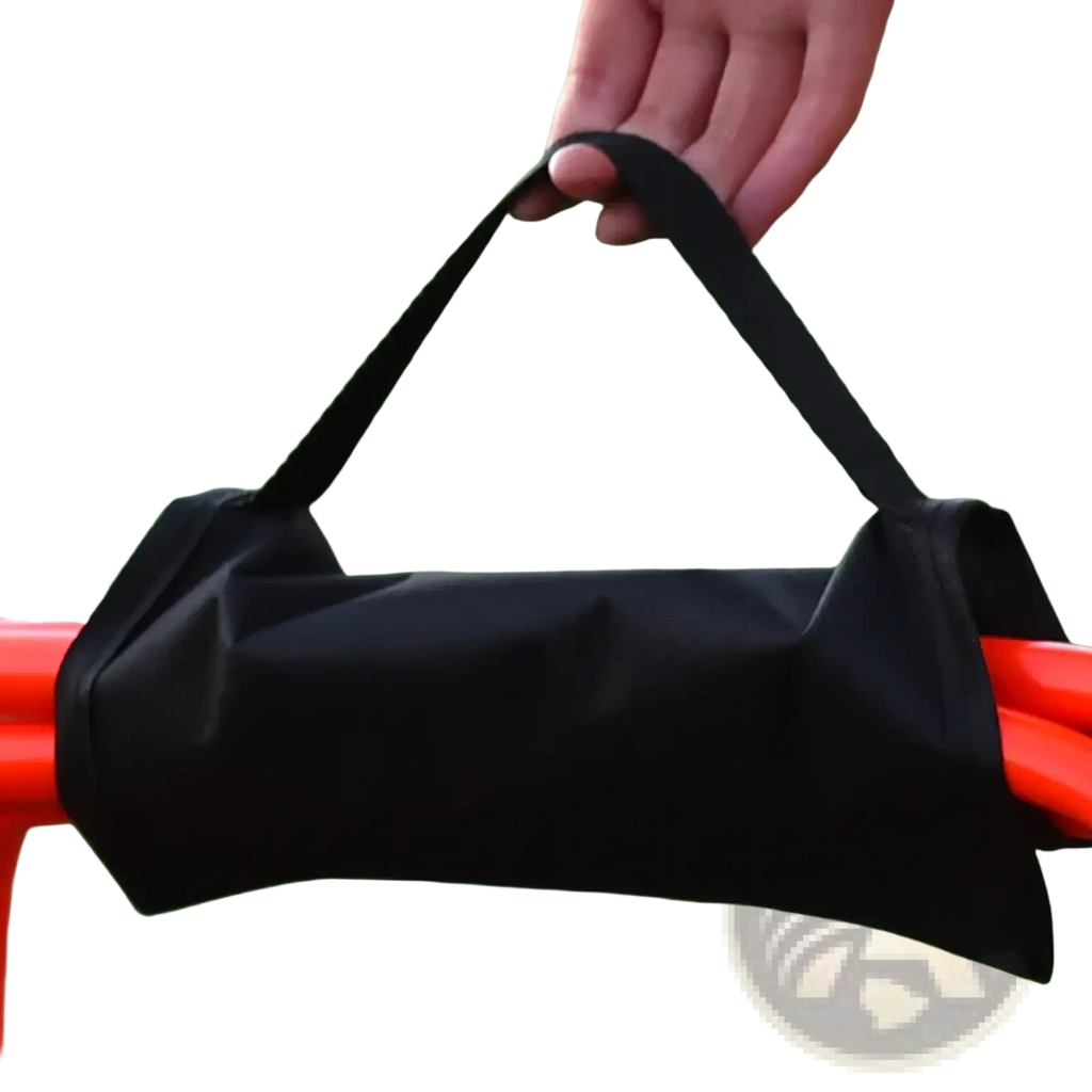 Black fabric soccer agility hurdle carrying strap and storage bag with sturdy handle holding orange training cones