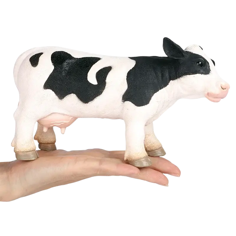 Soft animal figurine decompression toy finished goods black and white plastic cow with pink nose on hand