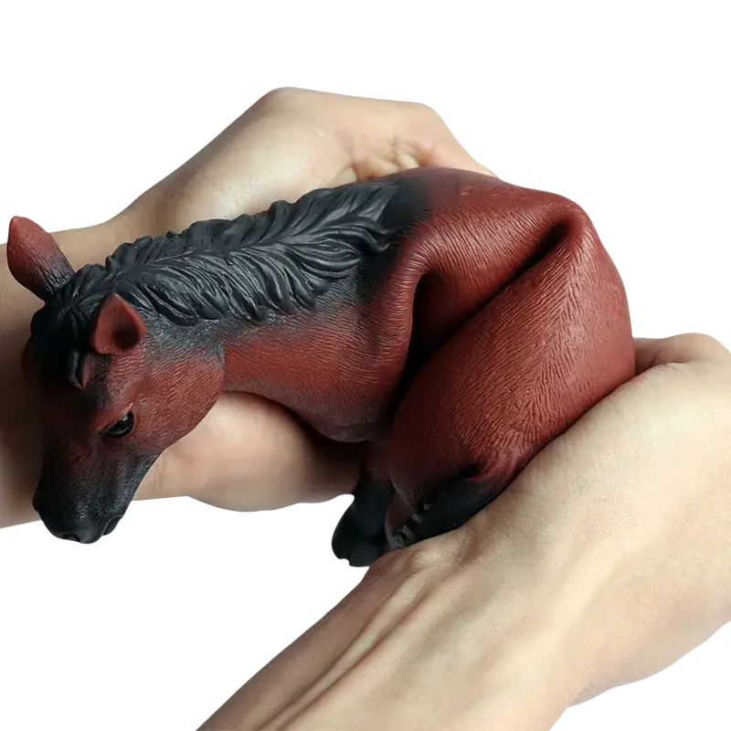 A red and black silicone horse-shaped stress reliever held in hands soft animal figurine decompression toys finished goods