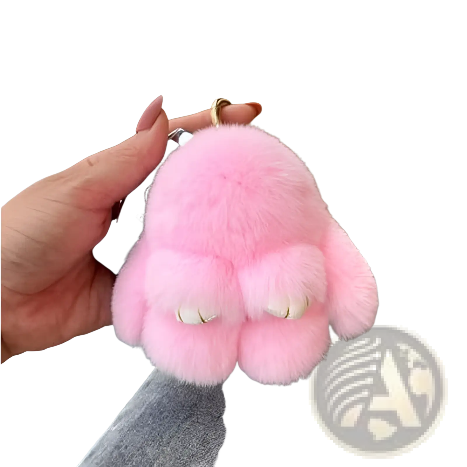 Soft fluffy bunny faux fur plush keychain accessory in pink with white and gold accented teeth