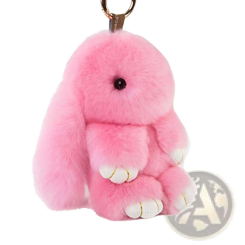 Soft fluffy bunny faux fur plush keychain accessory in pink with white paw pads and a gold-tone metal ring