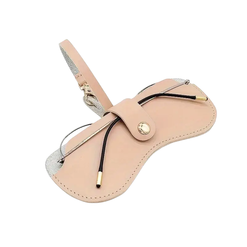Beige soft leather eyeglass case with silver trim and gold-tone hardware for stylish eyewear accessories storage