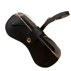 Soft black leather eyeglass case with gold-tone metal accents and strap ideal for eyewear accessories storage
