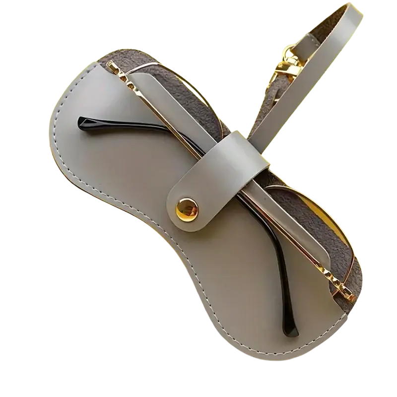 Soft leather eyeglass case in gray with gold-tone hardware and strap holding glasses for stylish eyewear accessories