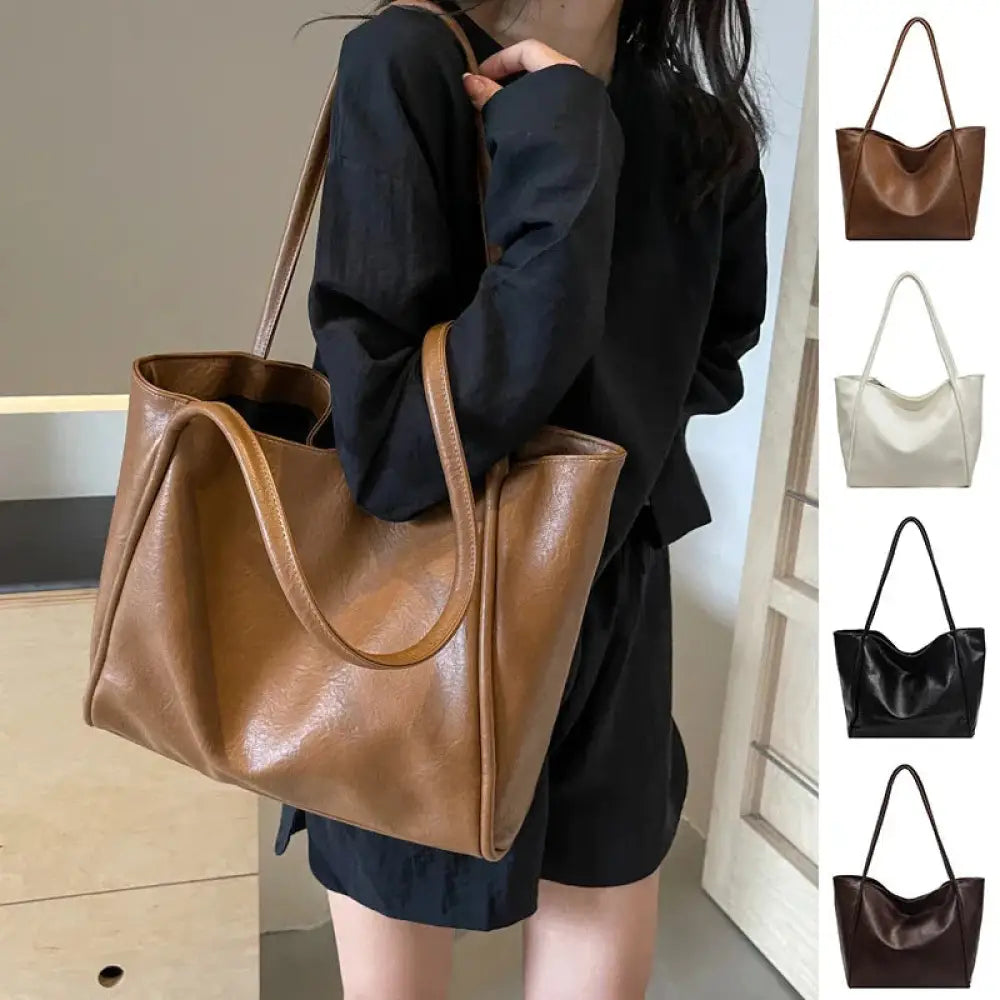 Brown faux leather large minimalist commuter tote bag with soft glossy finish and structured handles