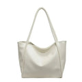 Cream-colored large commuter tote bag made of smooth glossy faux leather with a minimalist design