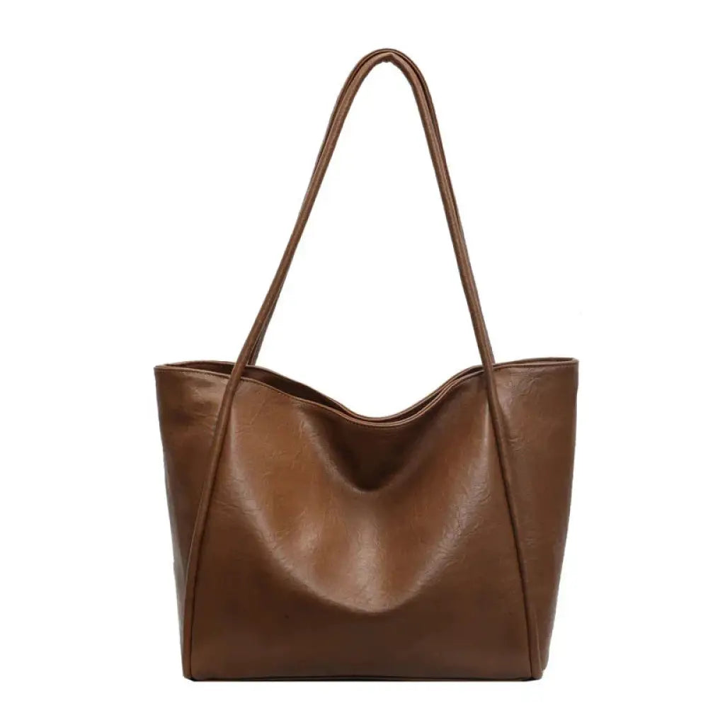 Brown large faux leather minimalist commuter tote bag with long handles for versatile daily use