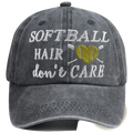 A dark gray distressed cotton baseball cap with embroidered white softball hair dont care text and yellow heart softball design