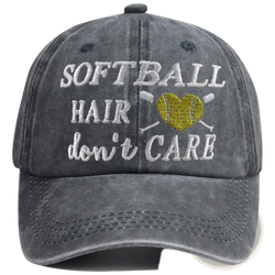 A dark gray distressed cotton baseball cap with embroidered white softball hair dont care text and yellow heart softball design
