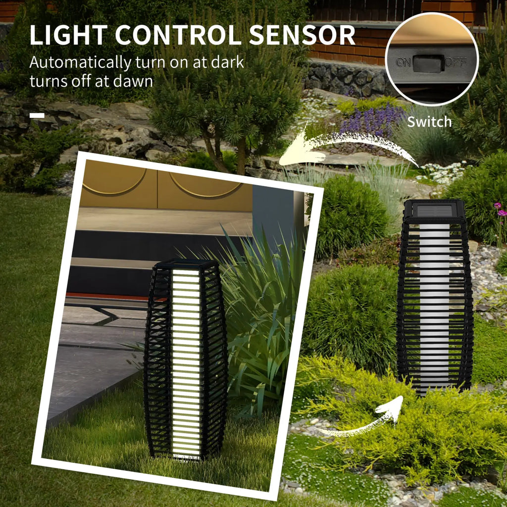 Black woven rattan solar floor lamp with vertical light panel that illuminates automatically for outdoor garden paths
