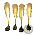 Four illuminated solar garden lights with waterproof yellow feather fibers and black bases in a 4 pack